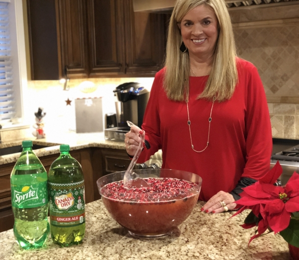 Mrs. Lynne Haney stirring a bowl of her famous holiday punch